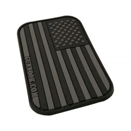 Black rubber patch featuring a stylized American flag with raised stars and stripes.
